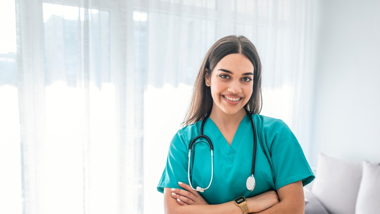 nursing student holding her books to her chest confident with survival guide