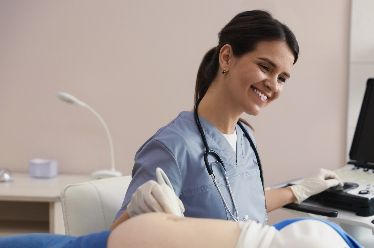 Obstetric nurse working with a patient