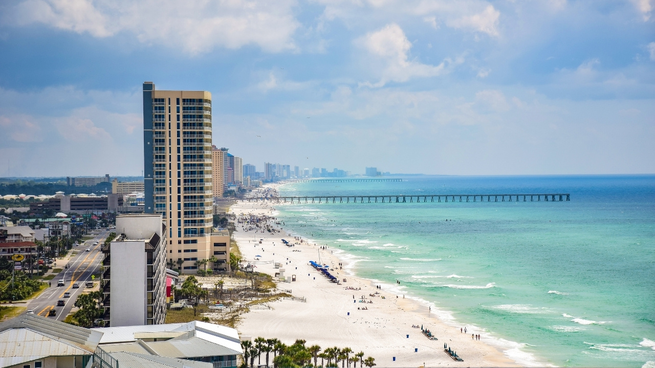 a view of the beach with some buildings
