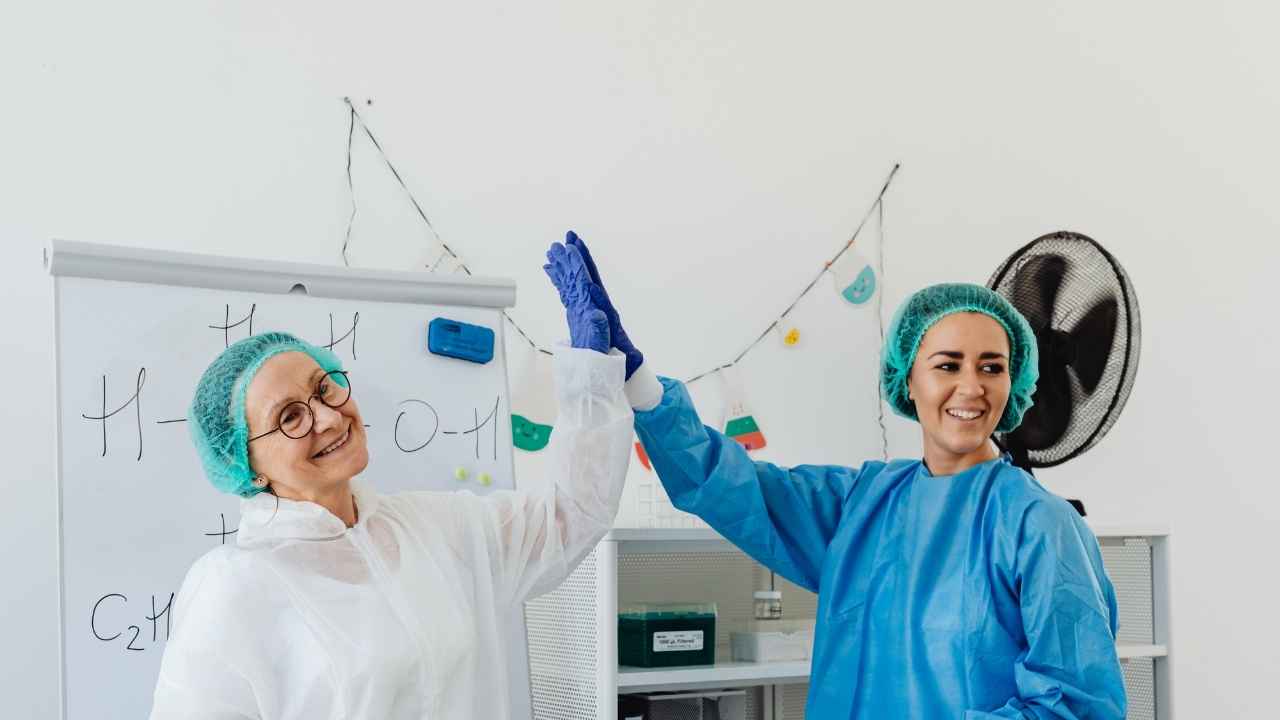 clinicians doing a high five