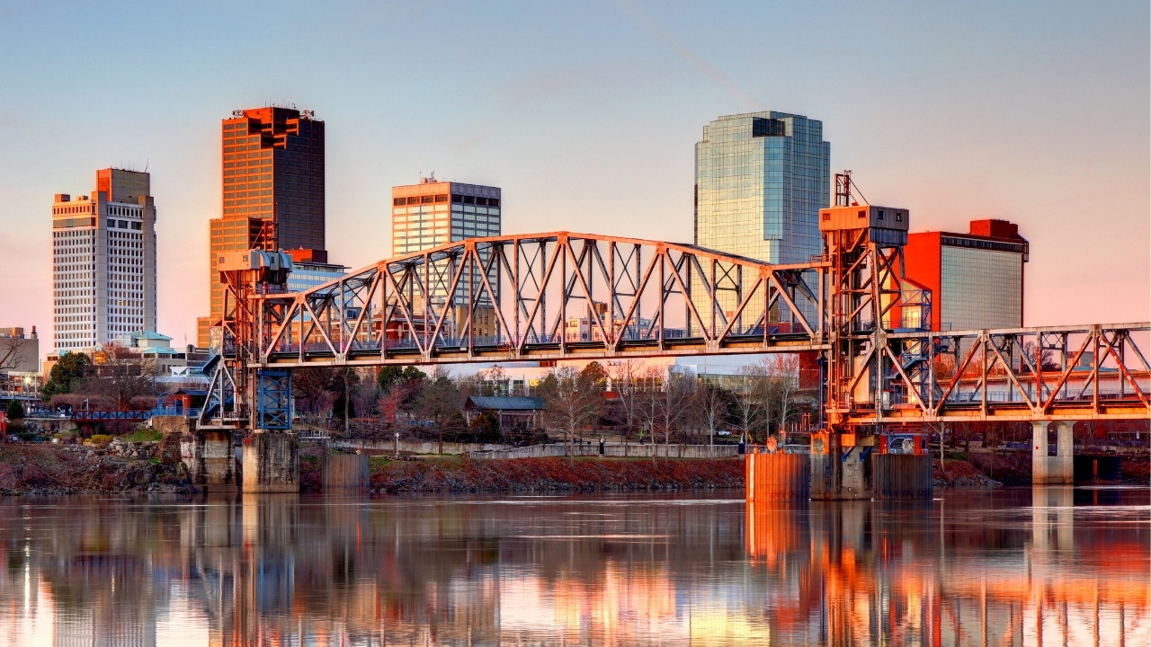a view of a river with buildings in the background