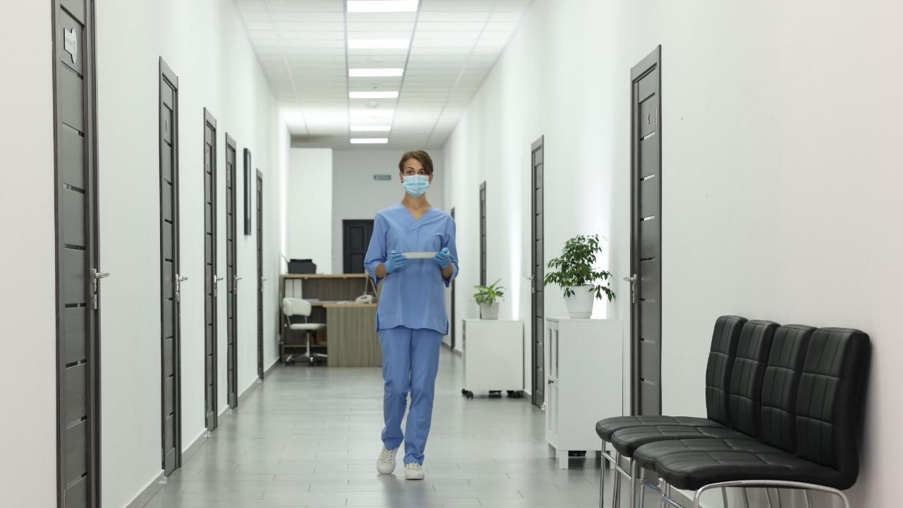 A nurse walking in the hallway