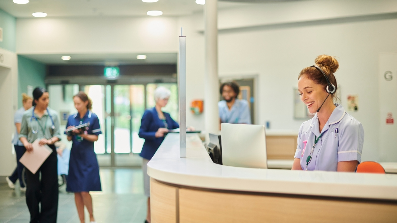Nurses station secretary, working
