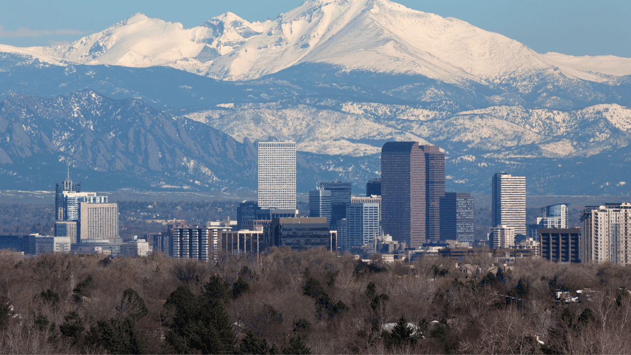 snowy mountains with condos positioned in a valley