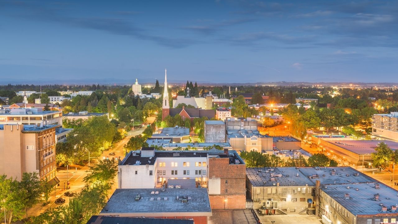 a view of a city in the beginning of the night