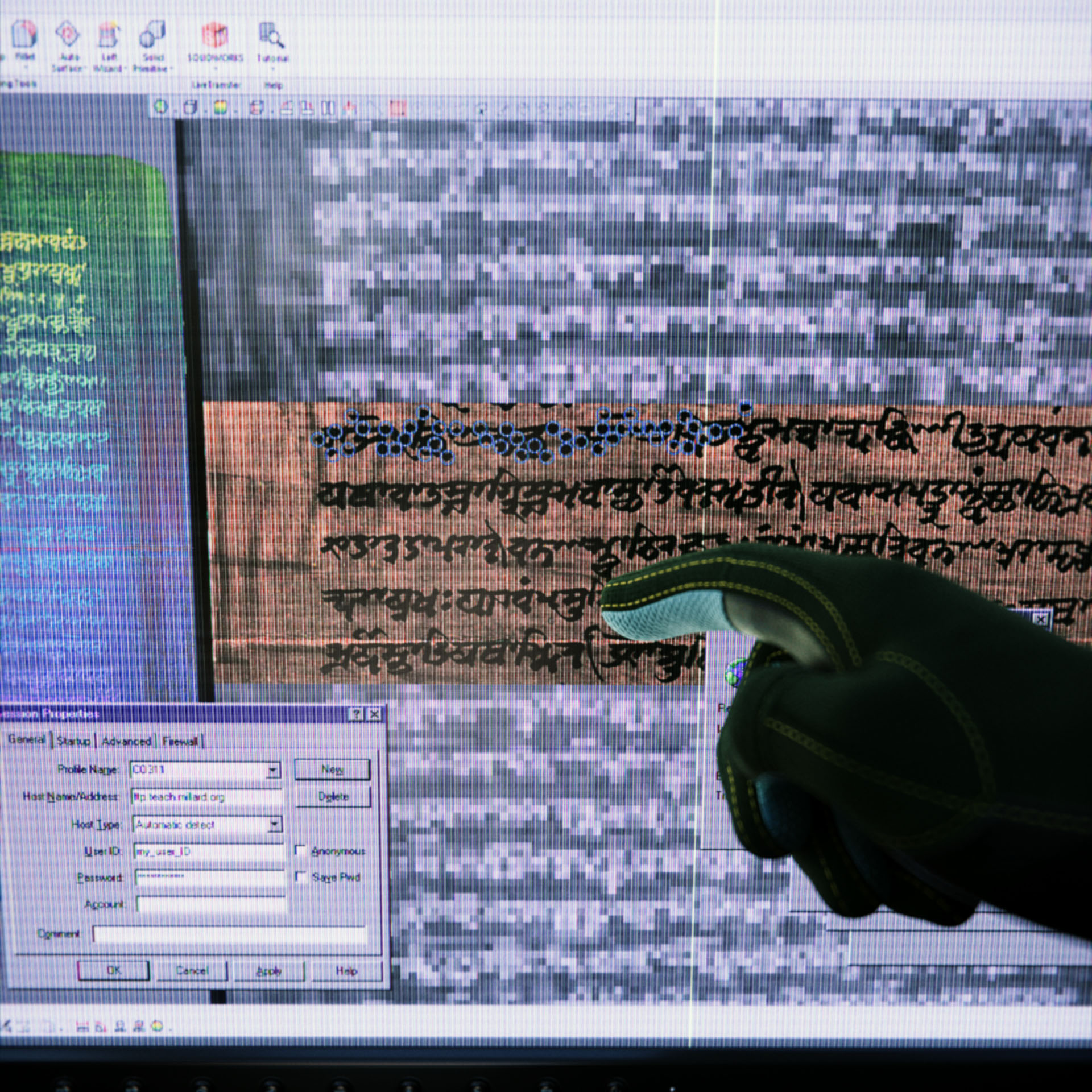 The hand of Daichi Kashiwagi wearing hazmat gloves pointing at a screen that is displaying the Atharvaveda scripture that has been scanned into the Library in Syntactic Labyrinths.