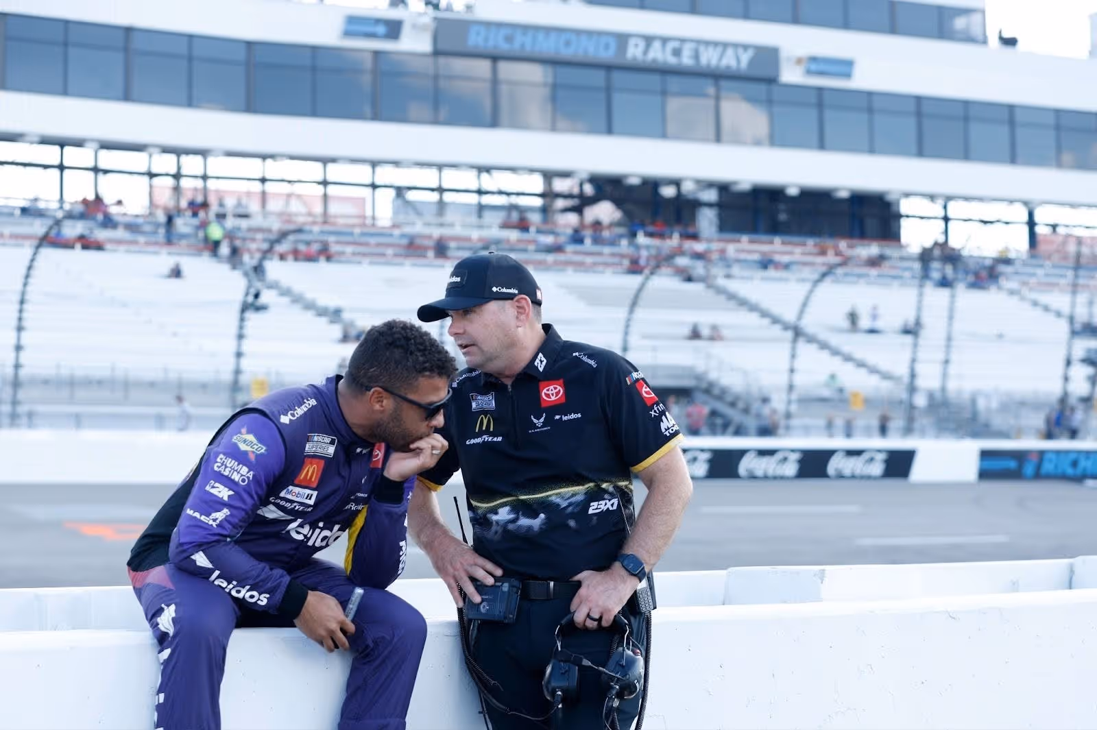 Bubba Wallace speaking with Charles Dinke