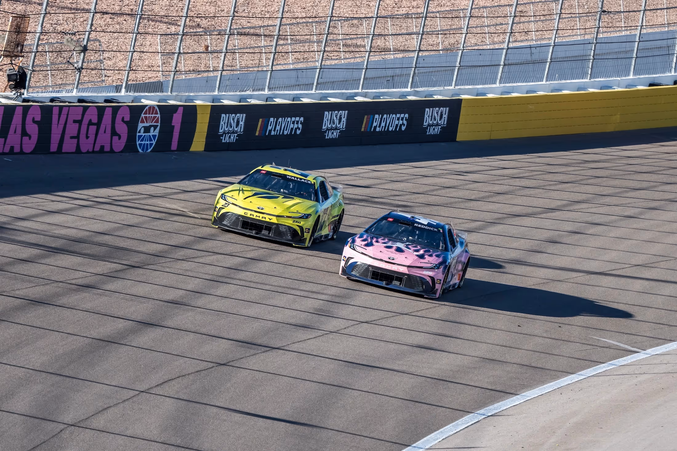 Bubba Wallace, Tyler Reddick, and Riley Herbst walking together graphic