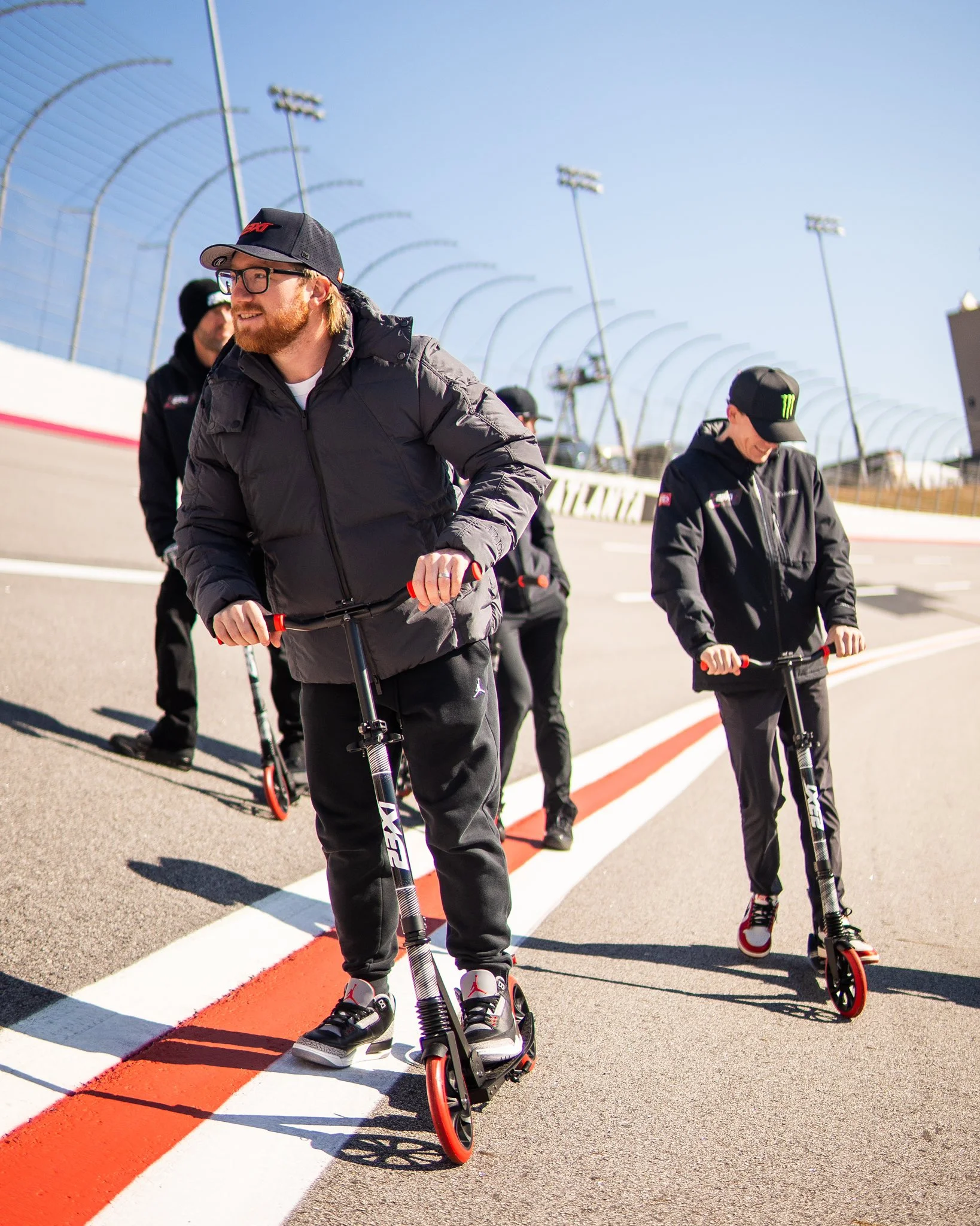 Riley Herbst hangs out of his car