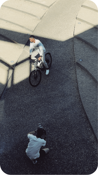 An image of two persons doing freelance biking in a park 