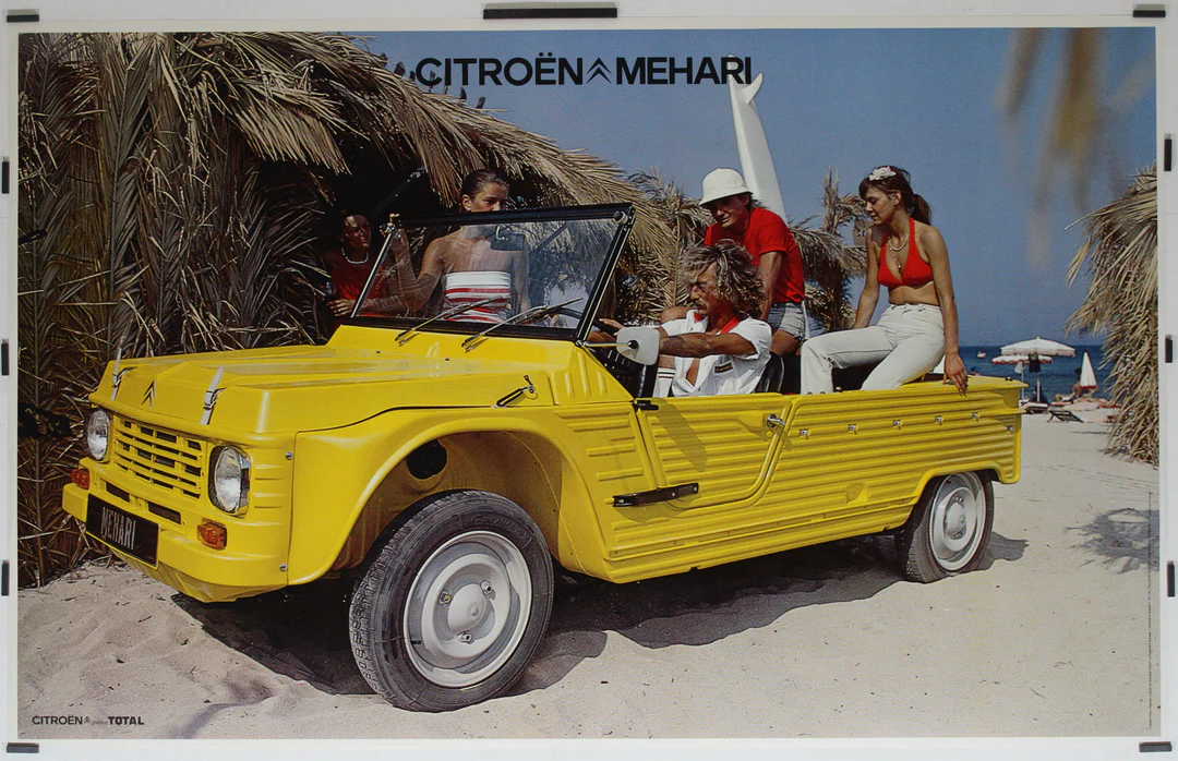 Yellow Citroën Mehari beach car on the beach with 3 person onboard