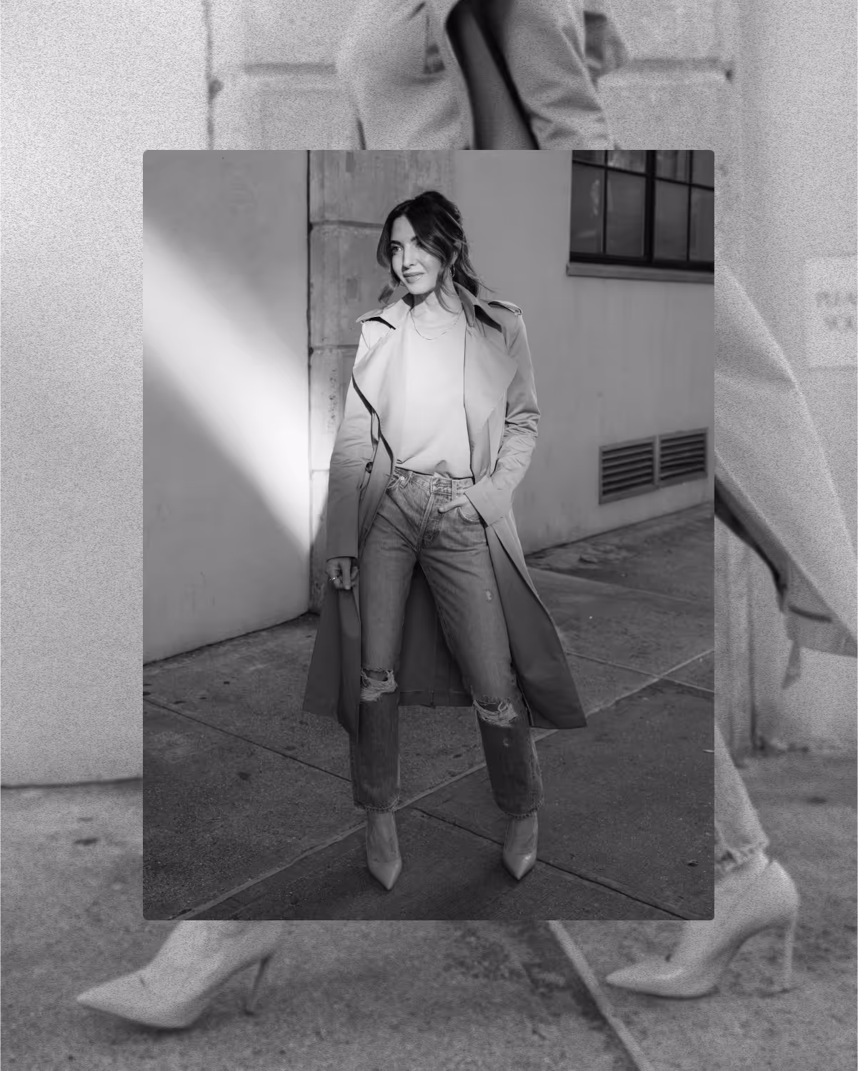 A high-fashion, black and white photo of Marie Forleo in a trench coat and heels.