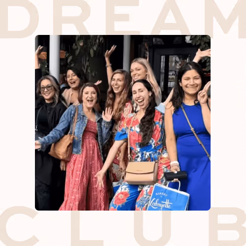 A photo of Marie Forleo''s Dream Club community smiling and happily waving together.