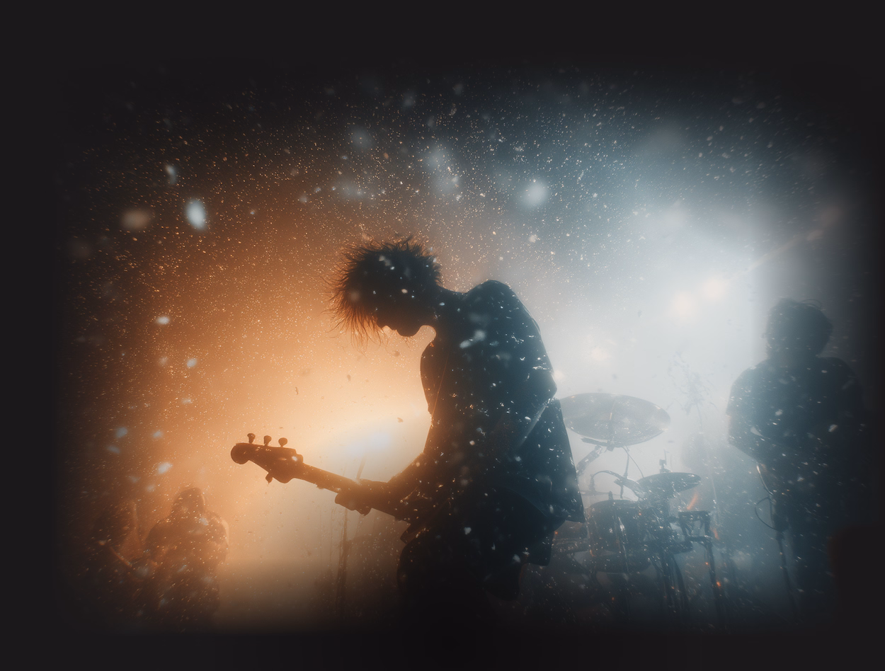 A dynamic photo of a guitarist on stage with a band performing live in the glowing ThorneLabs visual style
