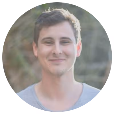 Paul Haggo from UneeQ headshot in a circle frame.