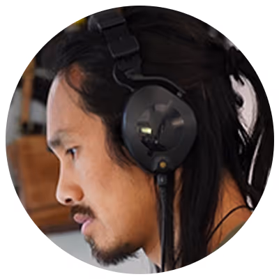 Victor Yuen, Chief Creative Officer at UneeQ, headshot in a circle frame.