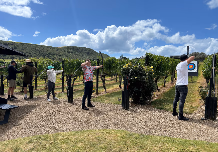 The UneeQ team — leaders in digital human and immersive training technology — doing archery in Auckland, New Zealand at an annual company summit.
