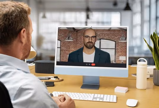 A learner and a digital human mid-conversation in a performance review roleplay.
