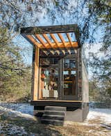 Exterior, Tiny Home Building Type, Glass Siding Material, Metal Siding Material, Wood Siding Material, and Flat RoofLine The tiny home was built on a trailer for easy mobility.&nbsp;