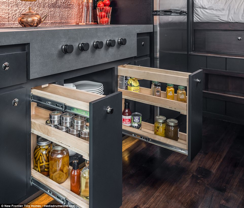 Not an inch of space is wasted as the designers have found ingenious storage solutions such as these cupboards 