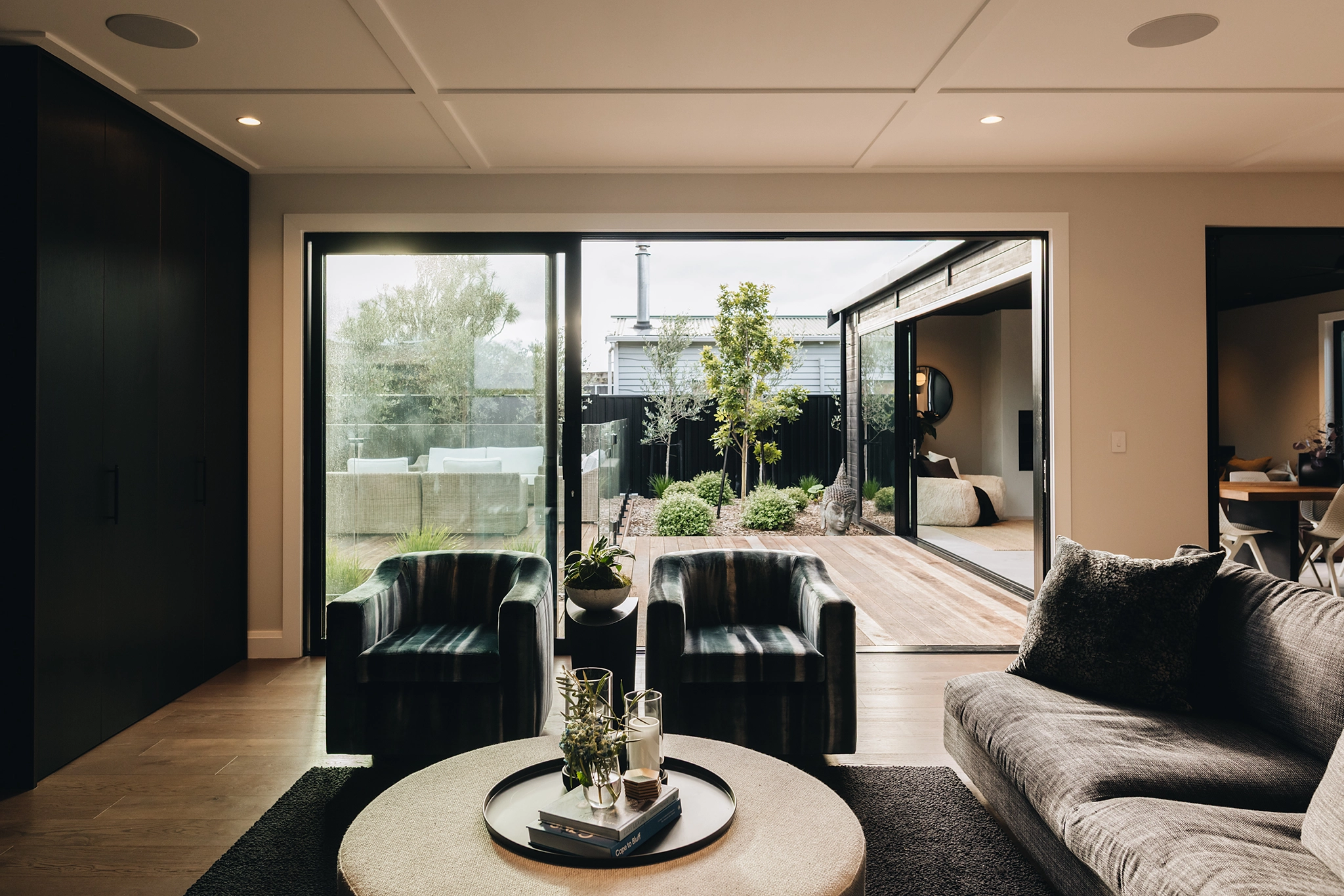 Wooden floors framing views toward pool and deck