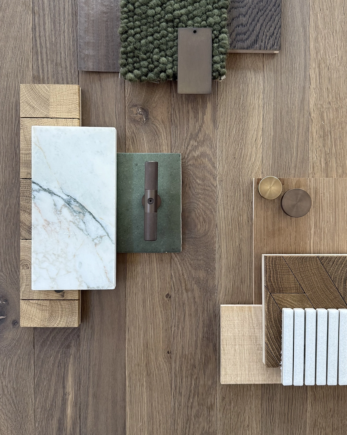 Smoked timber flooring with other interior finishes including carpet, tiles and cabinetry handles