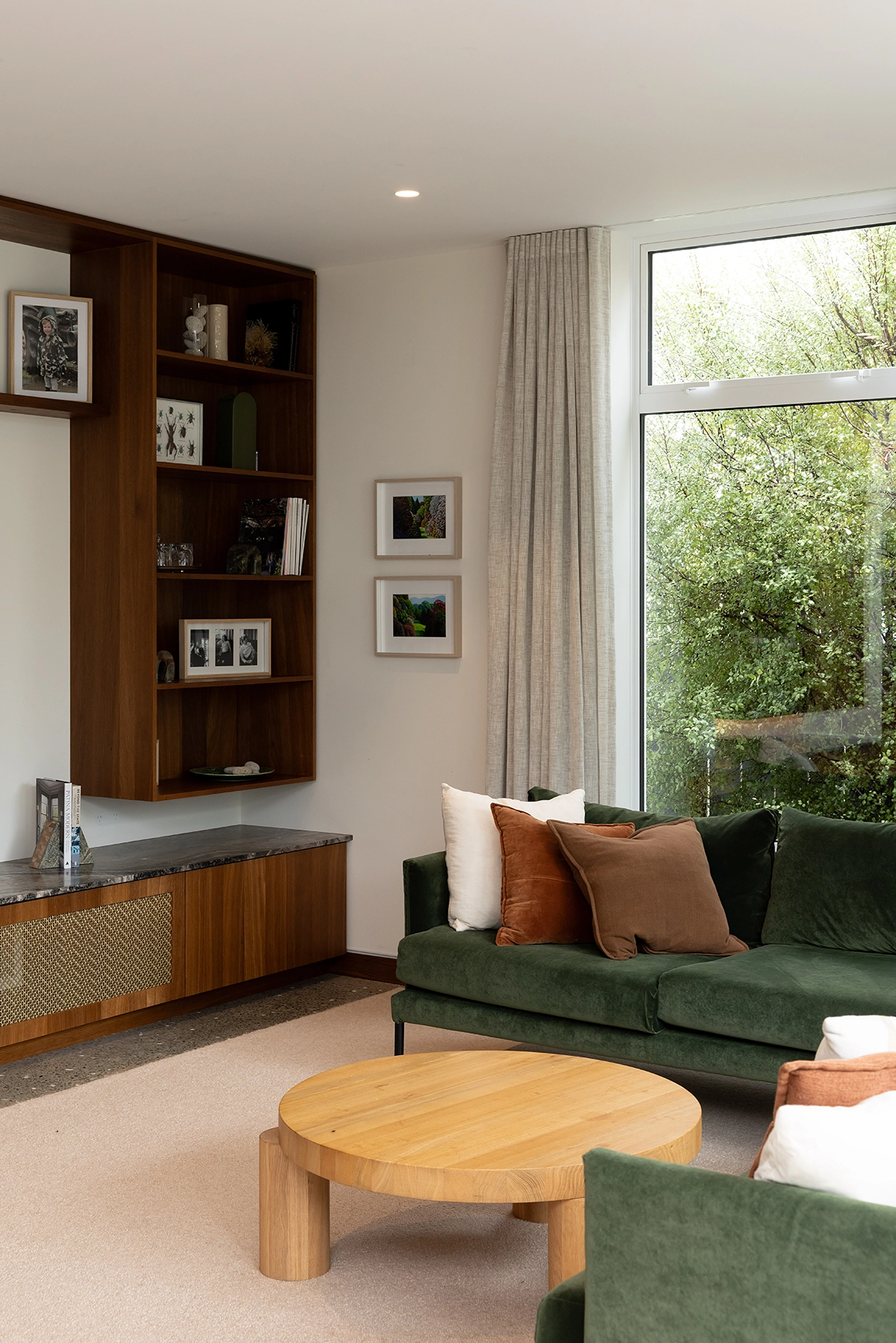 living room with in built smoked oak cabinetry and shelving