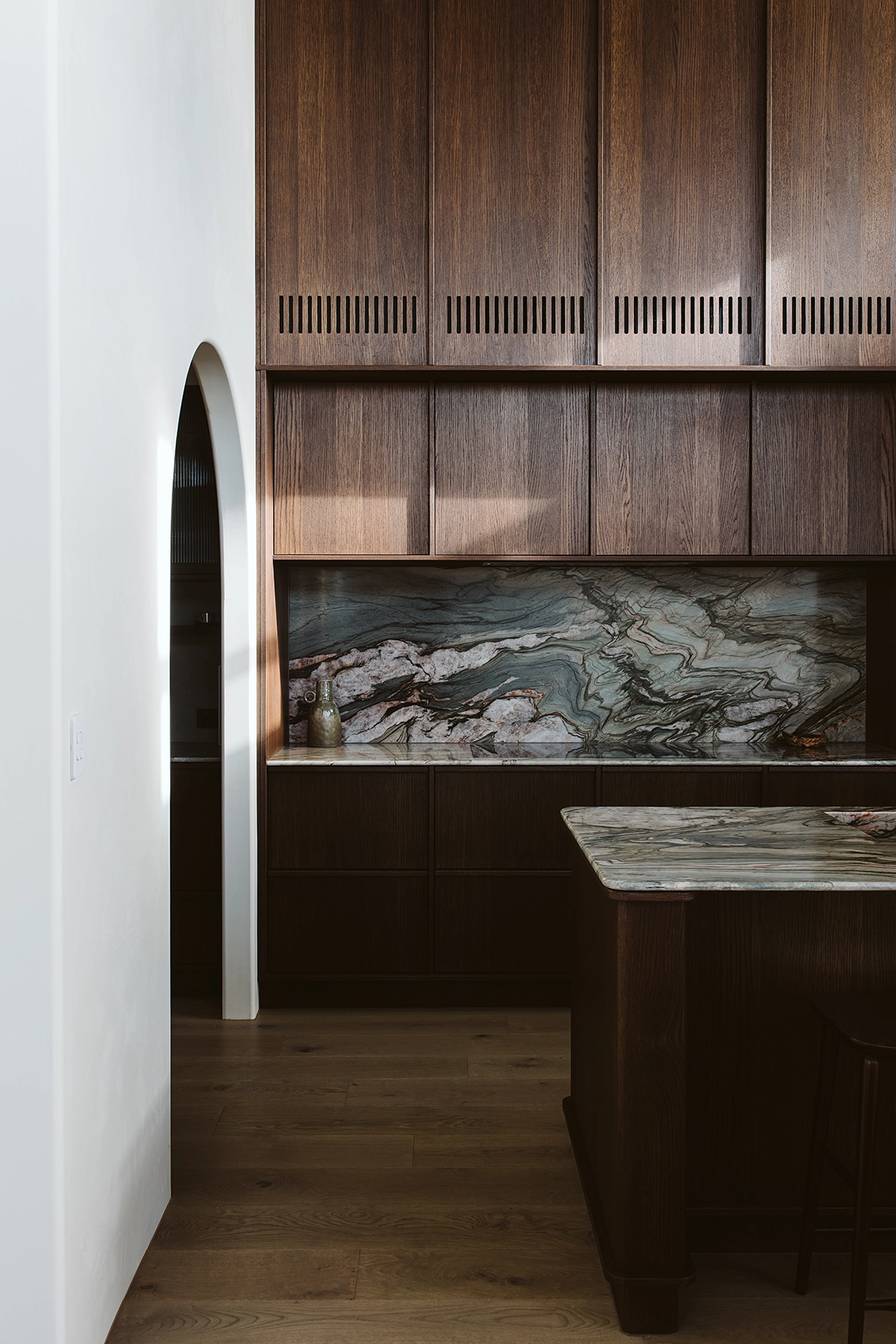 Dark oak veneer joinery with integrated air vents