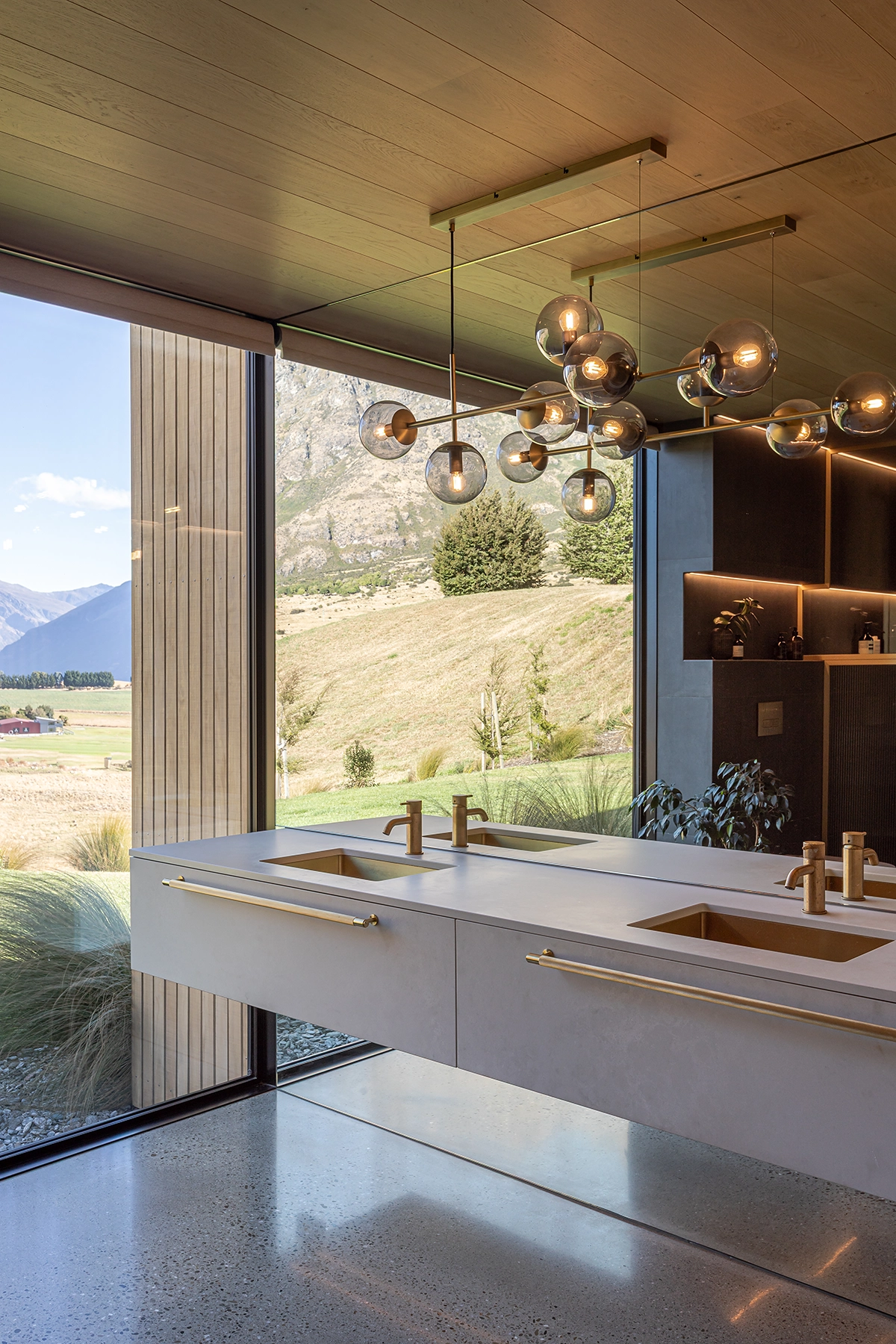 Bathroom ceiling lined with warm blonde timber planks