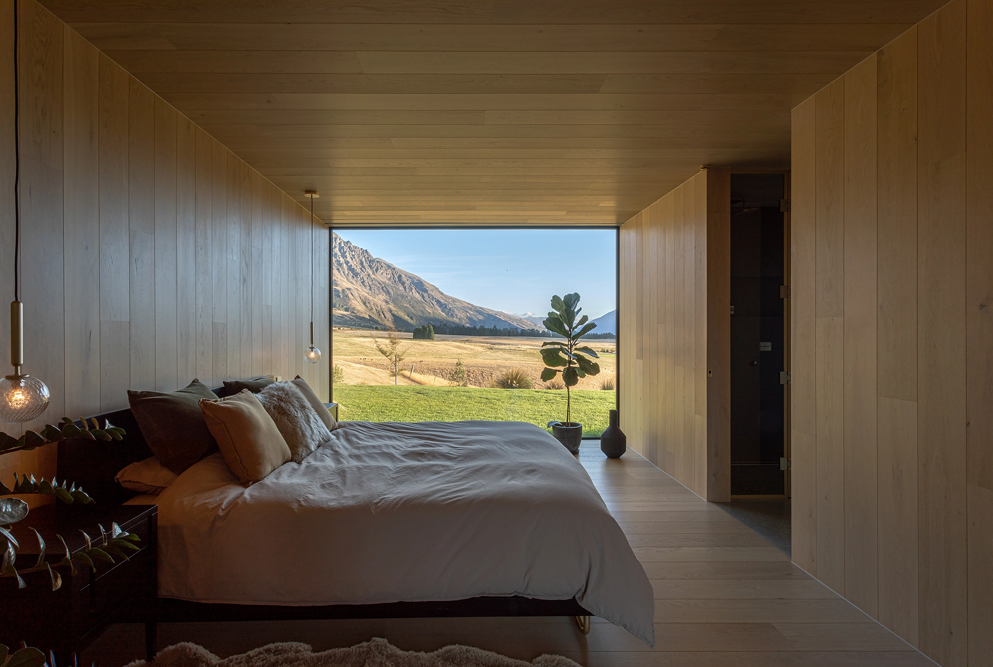 Blonde timber ceiling and walls in bedroom design
