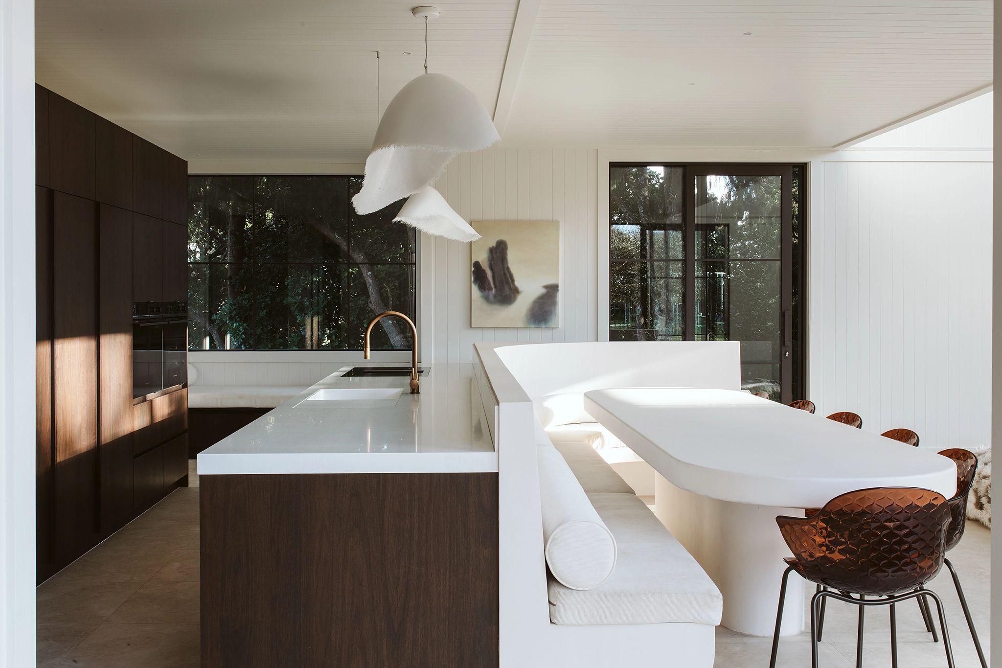 Modern family kitchen featuring walnut timber veneer cabinetry by Annika Rowson
