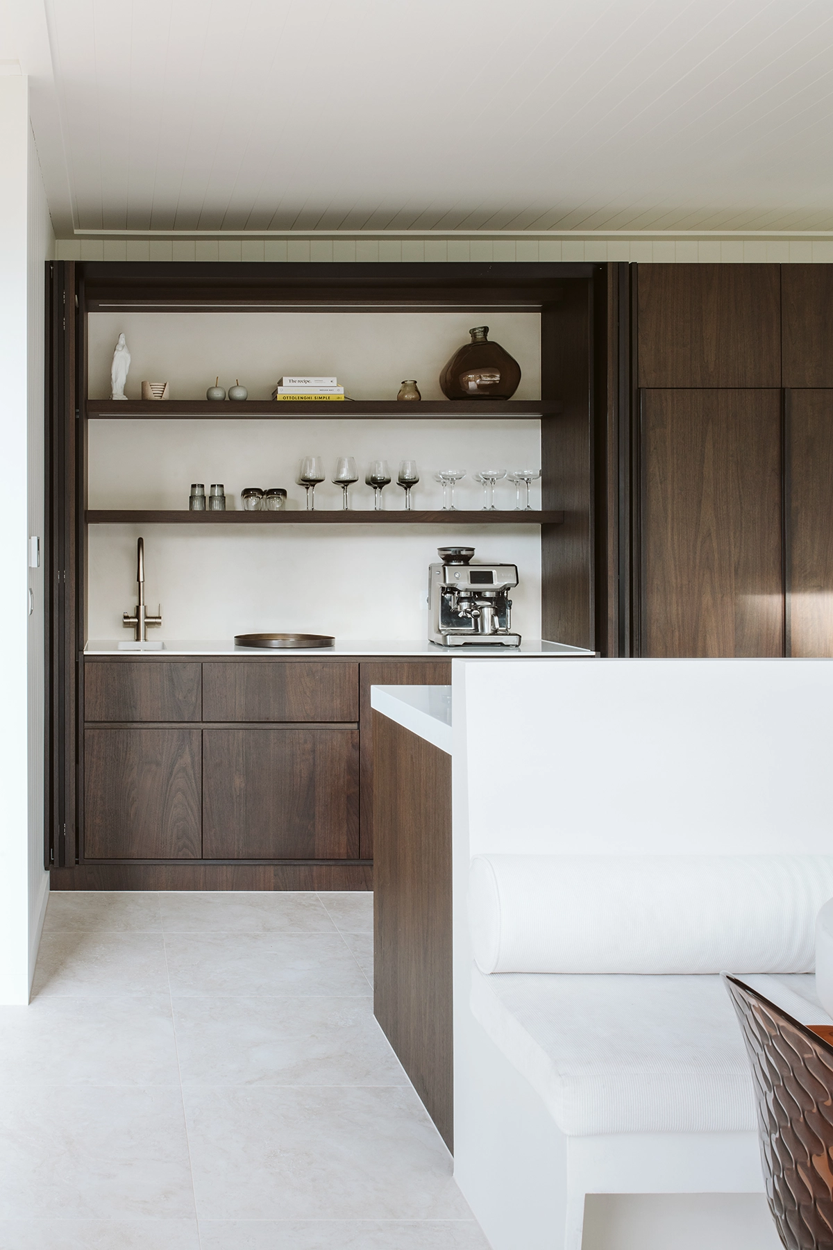 Minimalist family home interior with walnut timber veneer joinery