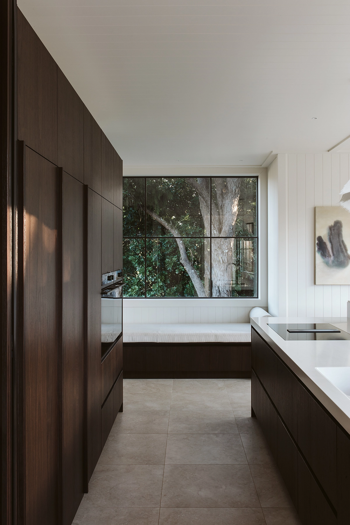 Family home kitchen with walnut timber veneer and sleek lines
