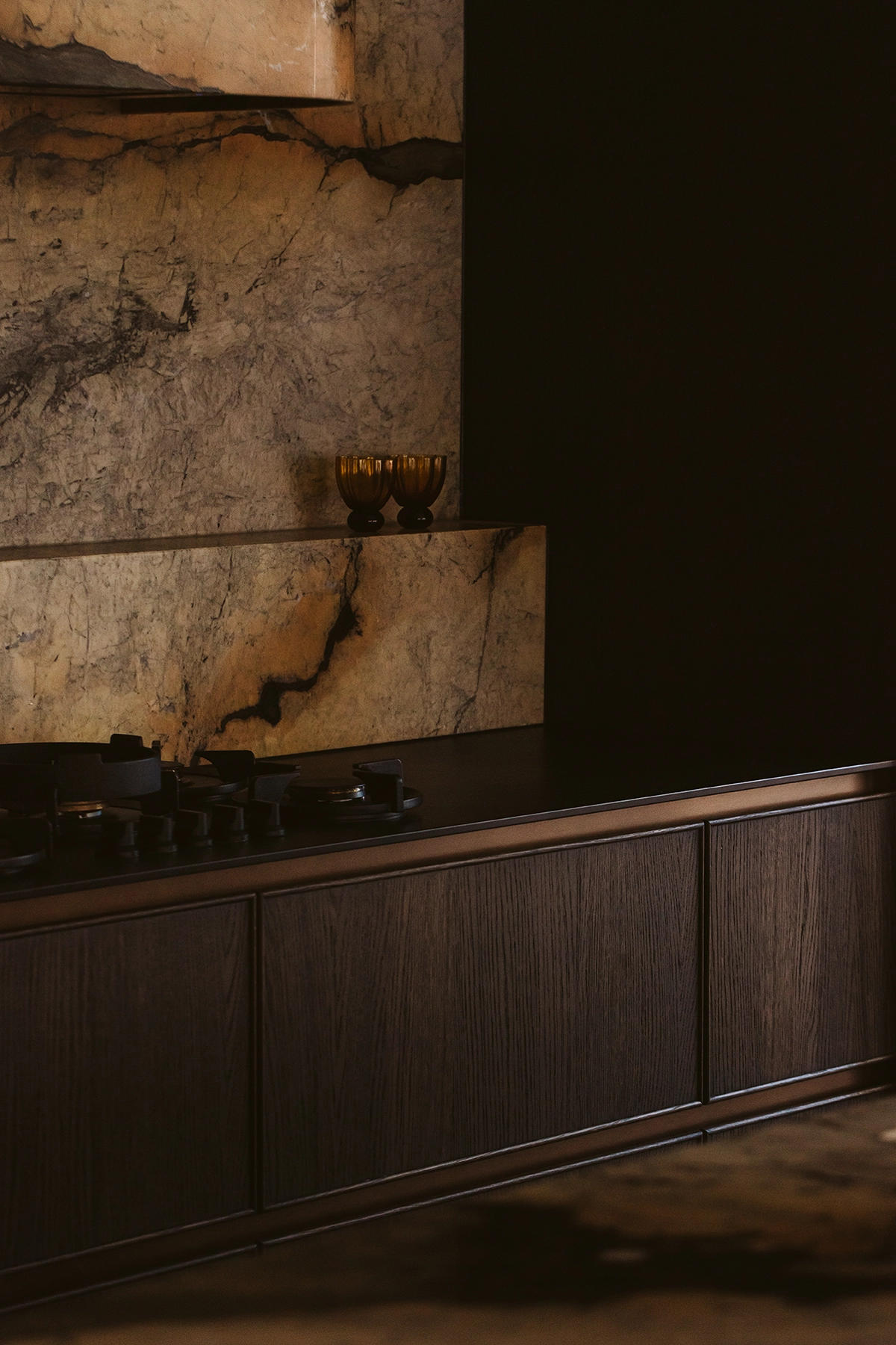 Spanish Revival kitchen design featuring dark timber joinery