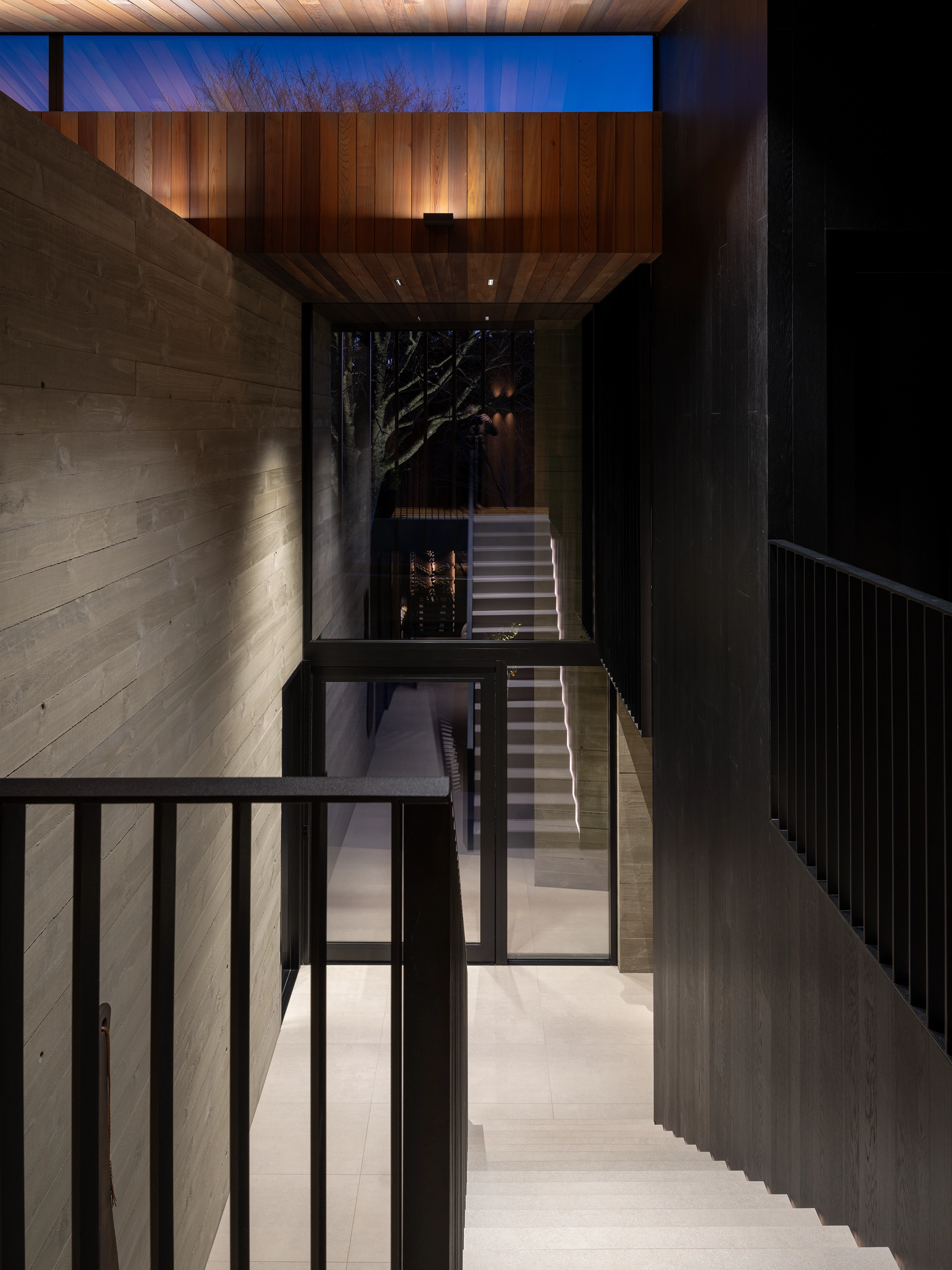 Sophisticated interior with dark oak veneer wall finishes