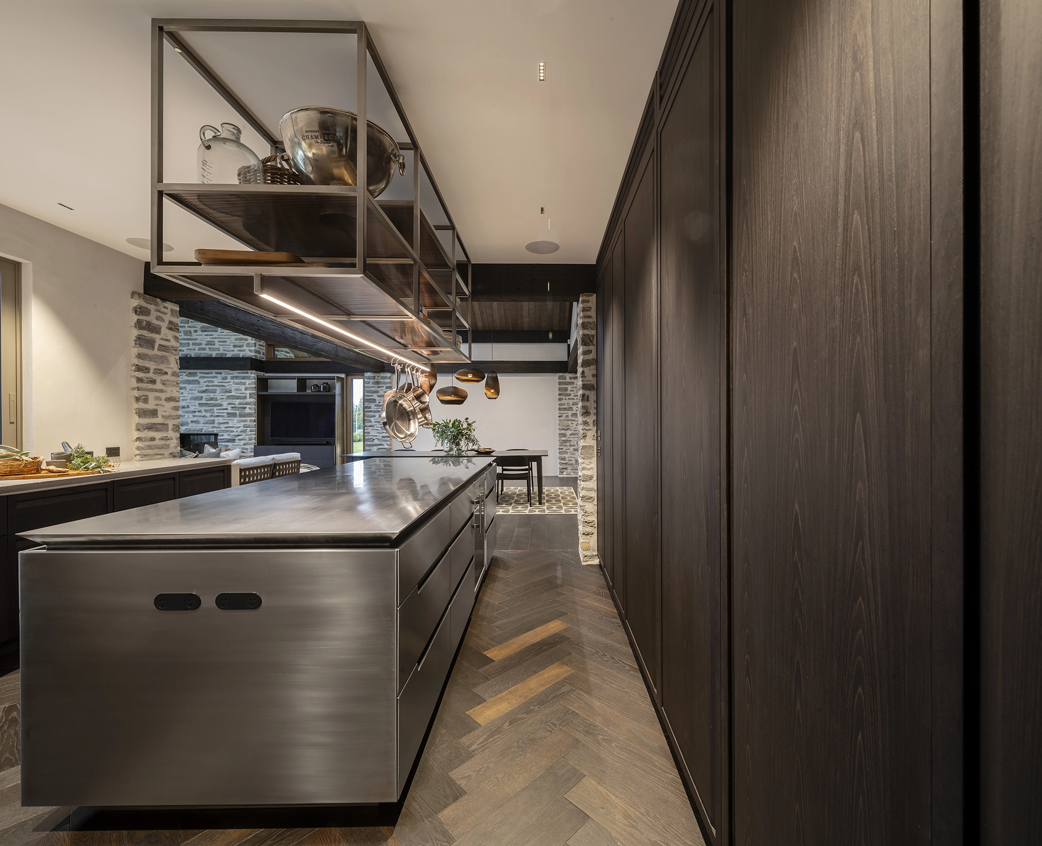 kitchen with warm tones and oak herringbone timber flooring