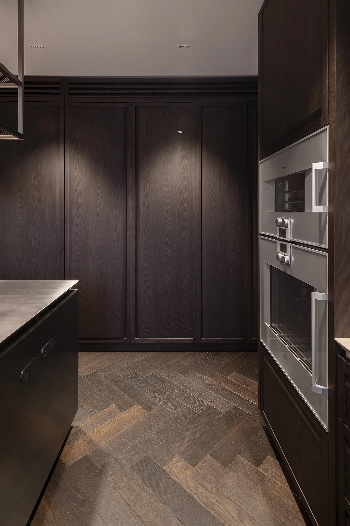 Central Otago kitchen interior with textured materials and timber floors