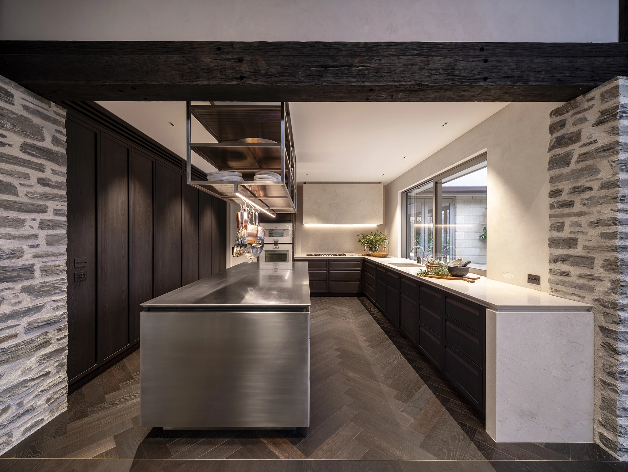 Kitchen with timber flooring designed for performance