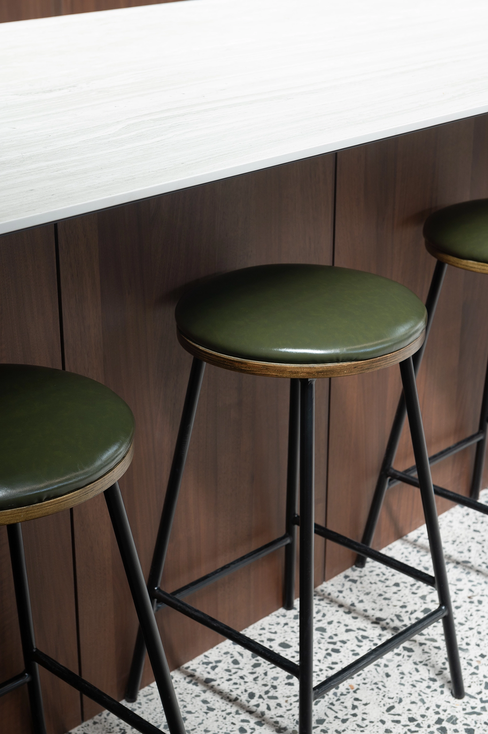 Office kitchenette featuring dark walnut timber veneer