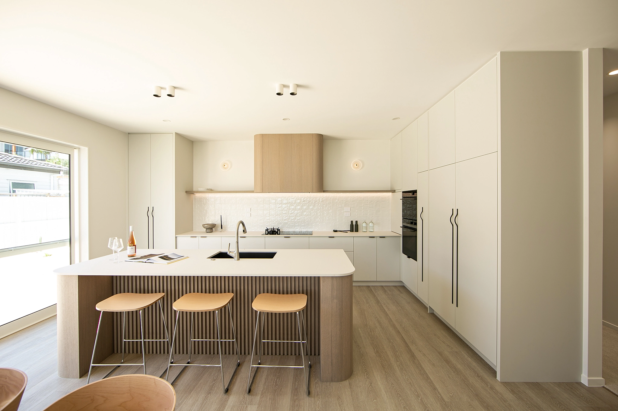 Kitchen cabinetry finished in Desert Oak Shinnoki veneer