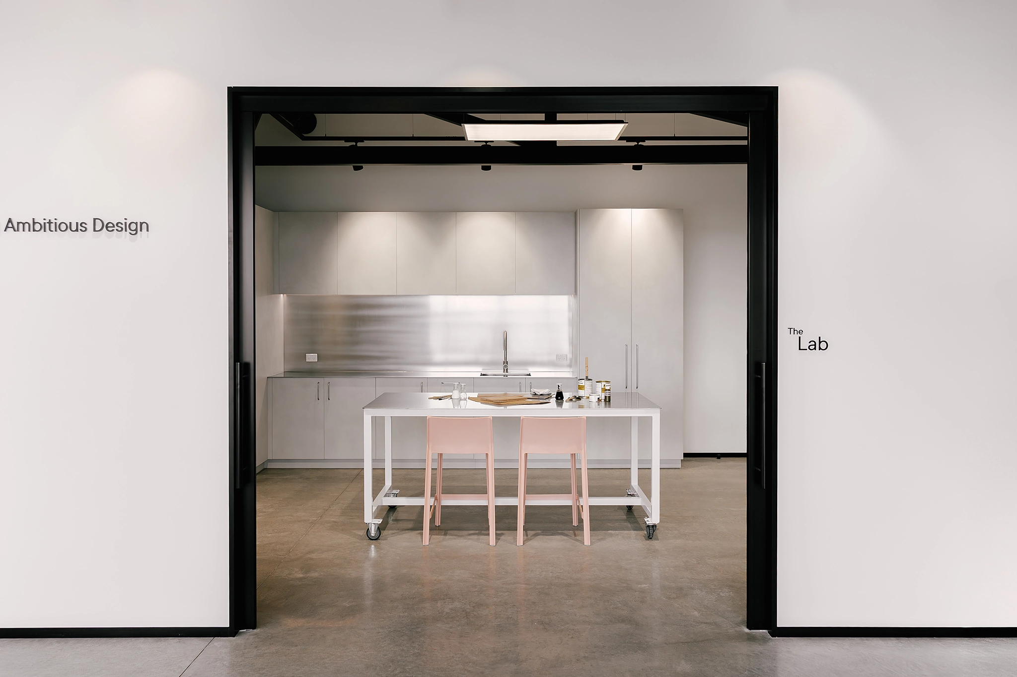 White hand-finished lime plaster decorative panels in kitchen joinery
