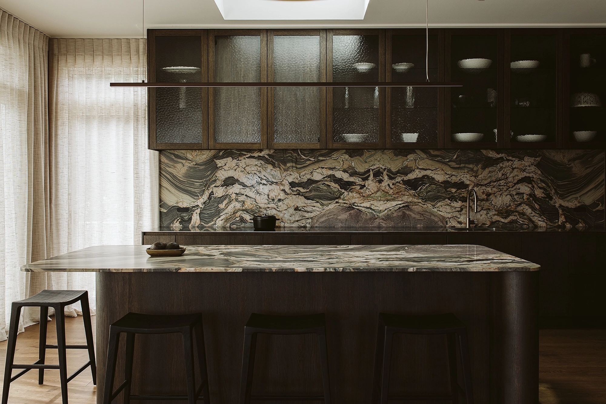 Modern kitchen featuring dark European oak cabinetry