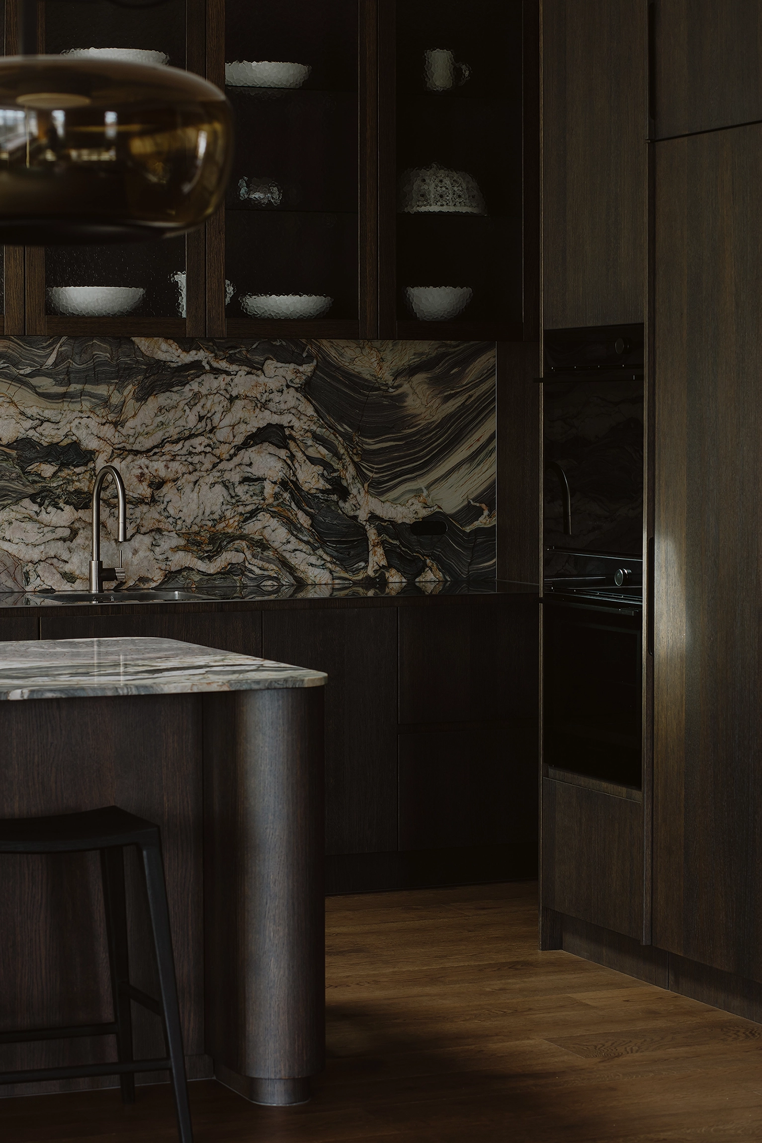Dark oak timber kitchen with integrated curves