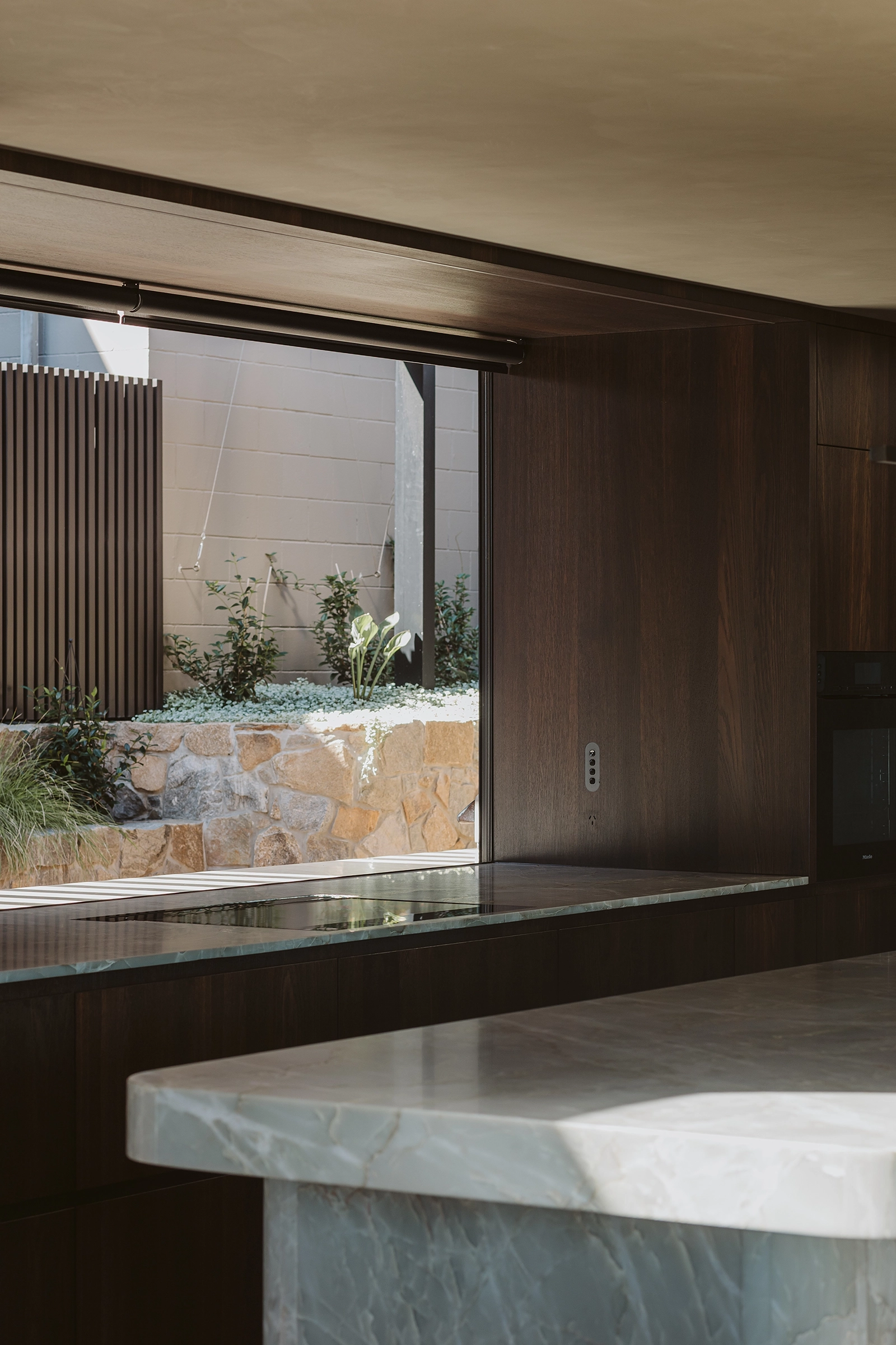 Dark smoked oak timber cabinetry in architectural home