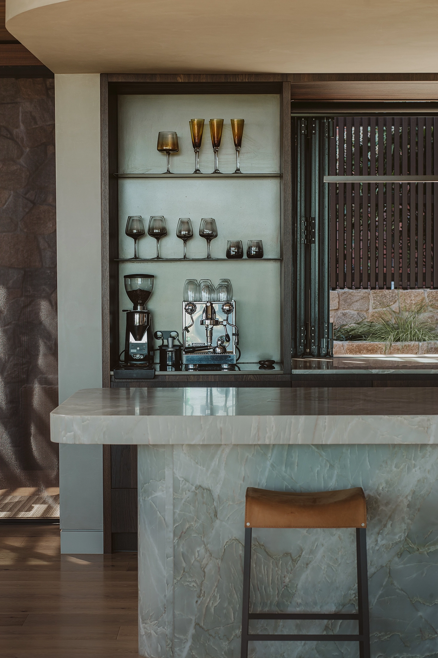 Smoked oak veneer kitchen joinery with stone surfaces