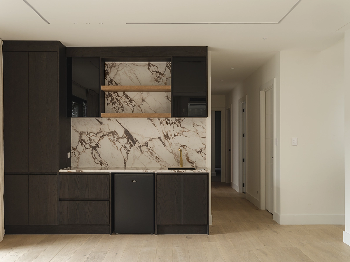 Elza timber flooring NZ flowing through kitchen, living and dining in an Auckland two-home development