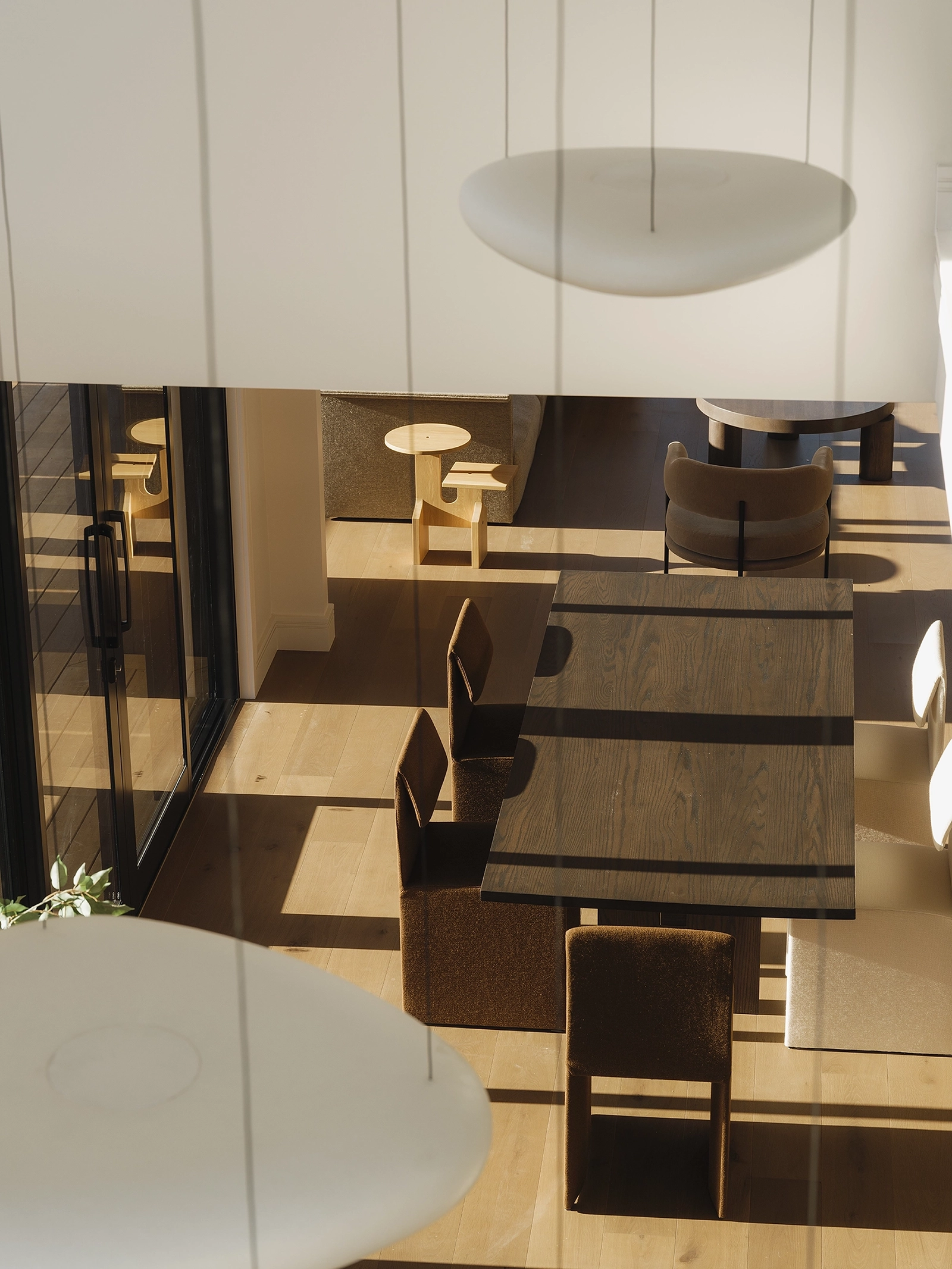 TRUNK Vetra smoked timber flooring NZ anchoring open-plan living and dining in Codrington Residence, Auckland