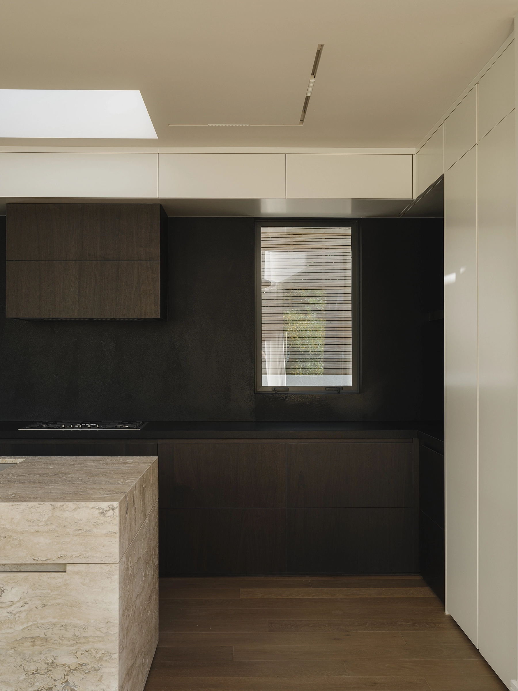 TRUNK Vetra smoked timber flooring NZ with overhead skylights pulling light onto stone and timber, Auckland