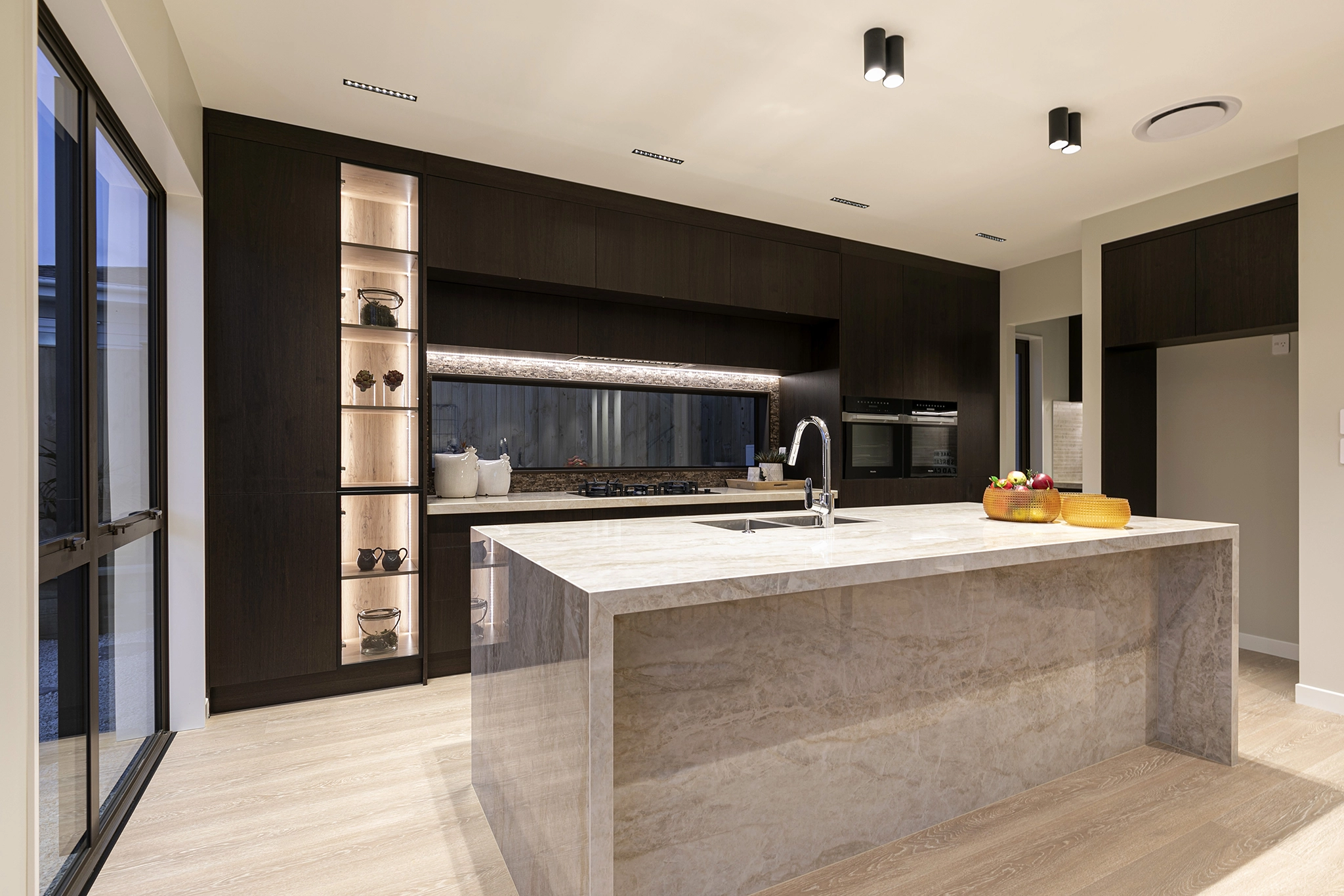 Dark timber joinery complementing outdoor views and reserve setting, Pepeke Way, Auckland, VidaSpace NZ