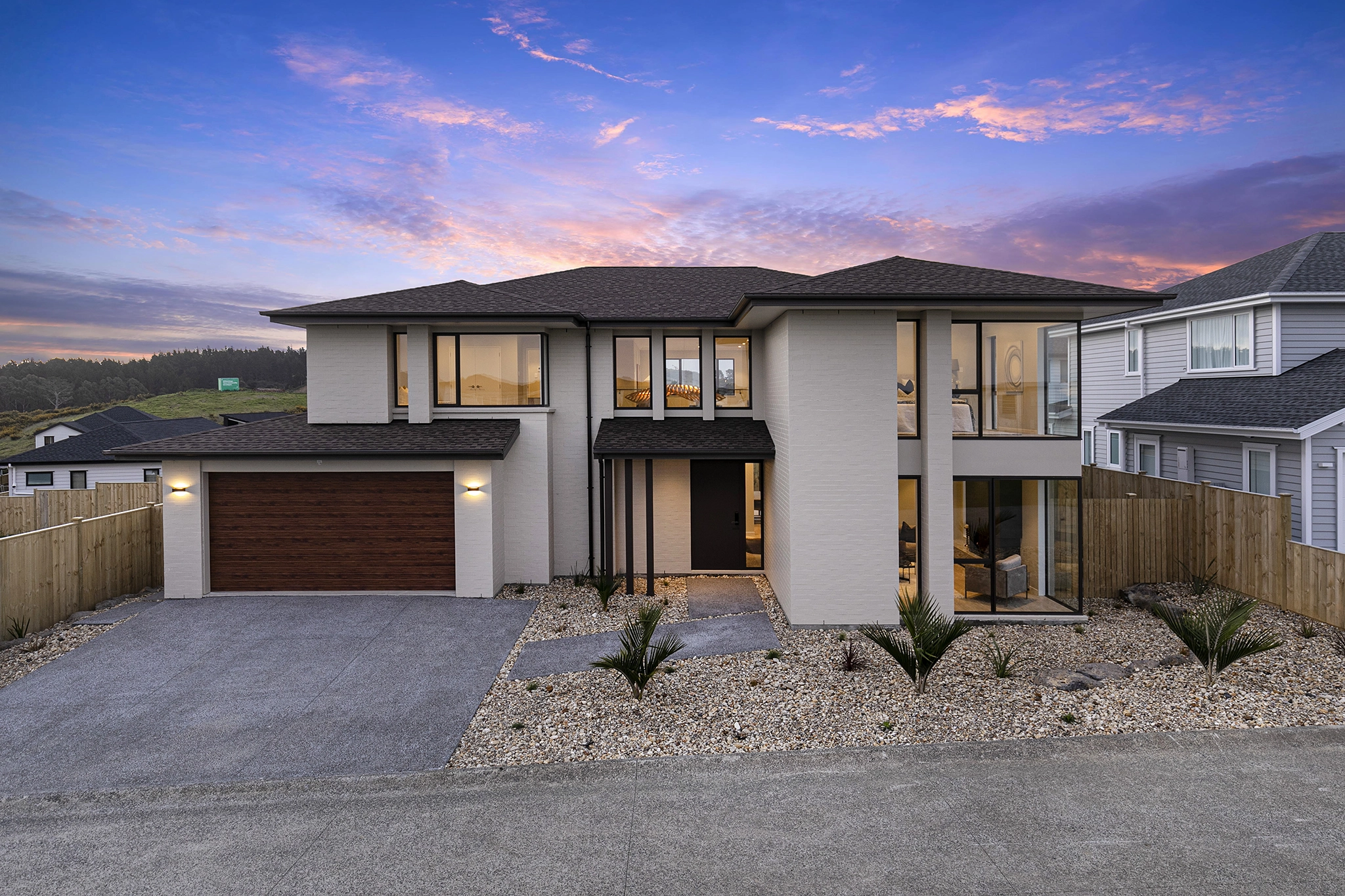 Pepeke Way Auckland kitchen with Stardust Walnut dark timber joinery in a Master Builders award-winning home